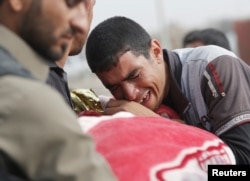 Похороны ребенка, убитого в результате обстрела со стороны джихадистов