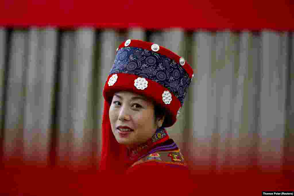 A delegate in traditional dress attends a news conference on the sidelines of China's National People's Congress in Beijing on March 6. (Reuters/Thomas Peter)