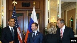 Presidents Barack Obama and Dmitry Medvedev with Foreign Ministers Hillary Clinton and Sergei Lavrov (left to right) at the bilateral U.S.-Russia meeting on the sidelines of an Asia-Pacific summit in Singapore on November 15