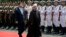Iranian President Hassan Rohani (right) and Chinese President Xi Jinping review an honor guard during the welcome ceremony at the Xijiao State Guesthouse in Shanghai in May 2014.