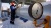 A Gazprom employee works at the Sudzha gas-measuring station, in Russia's Kursk region, just 200 meters from the Ukrainian border.