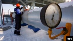 A Gazprom employee works at the Sudzha gas-measuring station, in Russia's Kursk region, just 200 meters from the Ukrainian border.