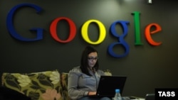 A woman works on a laptop at a Google facility in Moscow. (file photo)