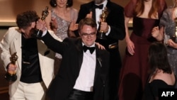 Former Russian schoolteacher Pavel Talankin celebrates winning the Oscar for best documentary.