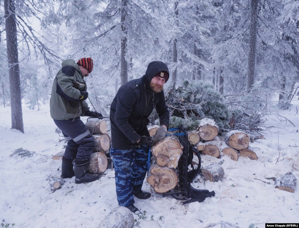Boleslav Vavilov collects firewood -- the only source of heating in the monastery.