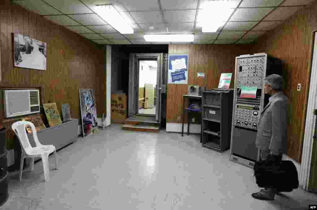 A man visits the former American embassy now turned into a museum in Tehran