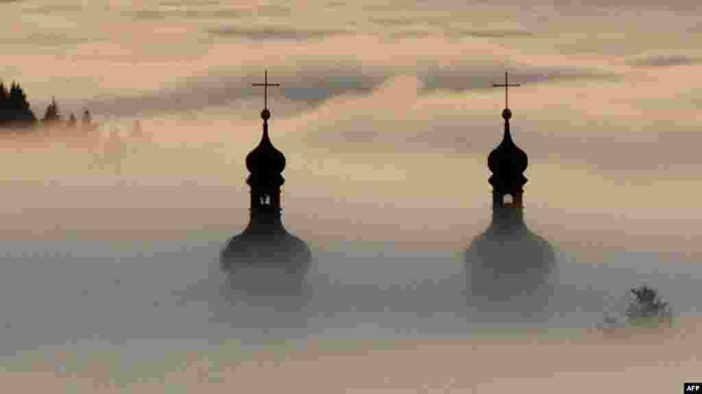 Church spires shrouded in fog at St. Peter&#39;s Abbey in the Black Forest, Germany, on December 27. (AFP/Rolf Haid)