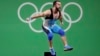 Спортсмен из Казахстана Ниджат Рахимов ликует на помосте Олимпиады. Рио-де-Жанейро, 10 августа 2016 года. 