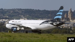 The hijacked Airbus A320 operated by Afriqiyah Airways after it landed at Luqa Airport in Valletta on December 23.