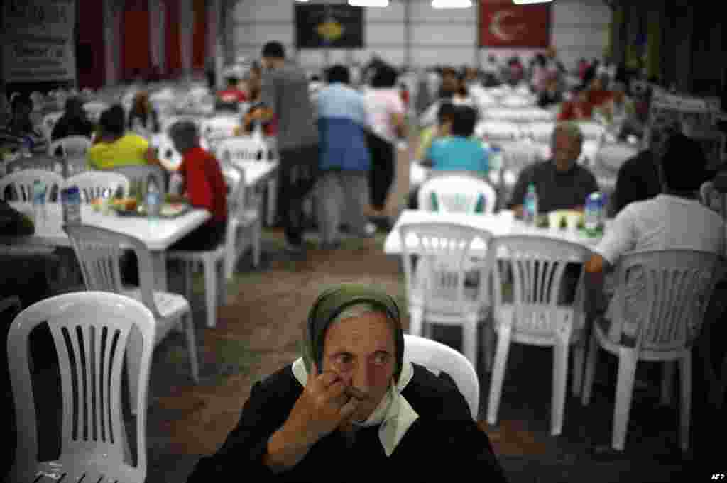 Muslims break the fast with a dinner distributed for free during the Muslim fasting month of Ramadan in Pristina. (AFP/Armend Nimani)