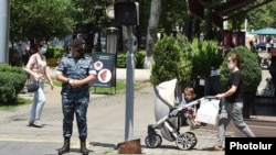 Armenia -- A masked police officer patrols streets of Yerevan, July 10, 2020.