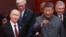 Russian President Vladimir Putin speaks with Chinese leader Xi Jinping before a military parade in Beijing’s Tiananmen Square on September 3. 