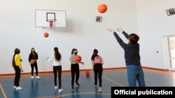 Armenia - Children play basketball at a school in the town of Gavar, March 9, 2021.