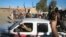 Al-Qaeda fighters celebrate on vehicles taken from Iraqi security forces on a main street in Fallujah.