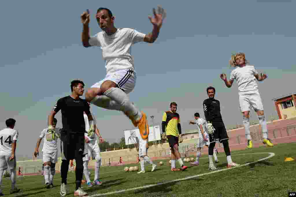 Afghan footballers participate in a training session at Kabul Stadium. (AFP/Shah Marai)