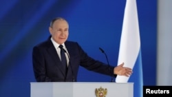 Ruski predsjednik Vladimir Putin drži govor na zajedničkoj sjednici ruskog parlamenta 21. aprila.