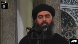 The leader of Islamic State, Abu Bakr al-Baghdadi, speaks at a mosque in the militant-held northern Iraqi city of Mosul in July 2014.