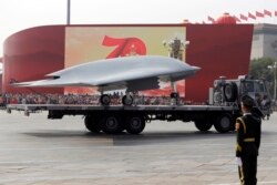 A Chinese military truck carrying a stealth attack drone during a military parade in Beijing in October 2019.