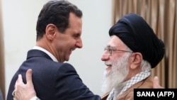 Khamenei greets Syrian President Bashar al-Assad in Tehran in 2019.