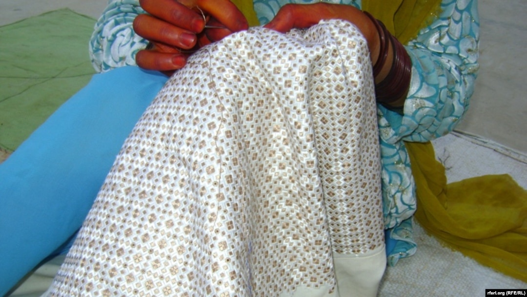 A woman stitches traditional Khamak embroidery in Afghanistan's Kandahar Province. The embroidery has become a "nice employment opportunity" for women in the region. 