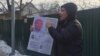 Serik Azhibai demonstrates in front of the Chinese Consulate in Almaty on January 22.