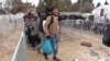 WATCH: Humanitarian groups in Serbia are providing winter clothing and warm food to migrants and refugees who are struggling to cope with falling temperatures. In spite of the cold weather, thousands of people continue to arrive in Europe each day. (RFE/RL Balkan Service)