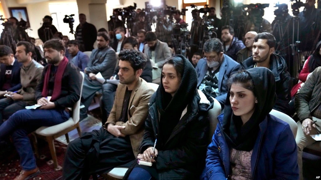 Afghan journalists attend a press conference by former President Hamid Karzai in Kabul in February 2022.