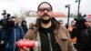 Kirill Serebrennikov speaks to the media before his court hearing in Moscow on October 25.
