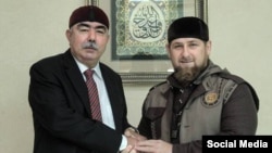 Afghan First Vice President Abdul Rashid Dostum (left) meets with Chechnya's Ramzan Kadyrov in Grozny on October 5.