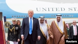 Saudi Arabia's King Salman bin Abdulaziz Al Saud welcome U.S. President Donald Trump during a reception ceremony in Riyadh.