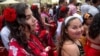 Girls walk in the parade of the Khamoro World Roma Festival in Prague on May 29, 2015.