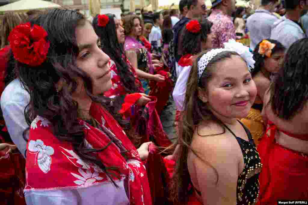 Girls walk in the parade of the Khamoro World Roma Festival in Prague on May 29, 2015.
