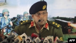 Bangladeshi Army spokesman Brigadier General Muhammad Masud Razzaq briefs reporters on January 19 on what was described as a failed coup attempt.