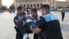 Armenian police officers carry Rise Armenia activist David Sanasarian from the scene of protest, Yerevan, 29July2015