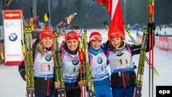 Germany - Eva Puskarcikova (L-R), Gabrela Soukalova, Vitkova Veronika and Jitka Landova of Czech Republic cheer after winning the 4x6 km women's relay race during the Biathlon World Cup at the Chiemgau Arena in Ruhpolding, Germany, 14 January 2015