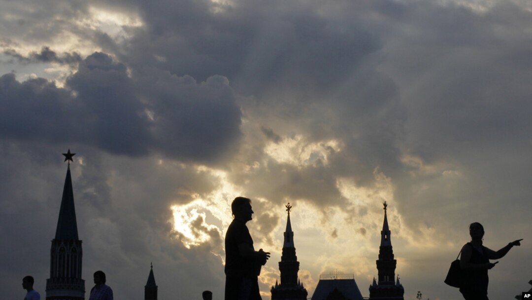 The sun sets on Red Square near the Kremlin.