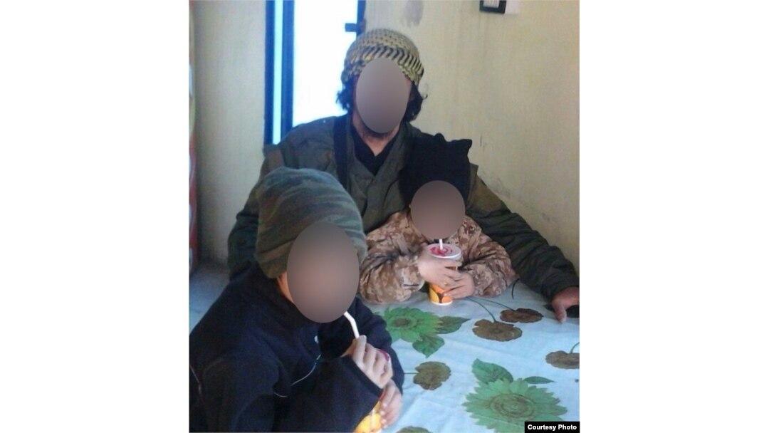Asan in Syria with his older brother and father, both of whom reportedly died in air strikes