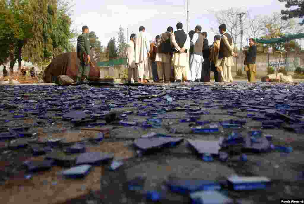 Afghans gather at the site of a suicide attack in Jalalabad. (Reuters/Parwiz)