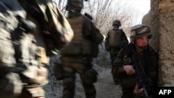 French soldiers take part in a patrol near Tagab in Kapisa Province in January 2010.