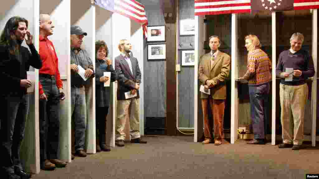 The 10 registered voters in the small village of Dixville Notch, New Hampshire, wait to cast the first ballots moments after midnight on election day.