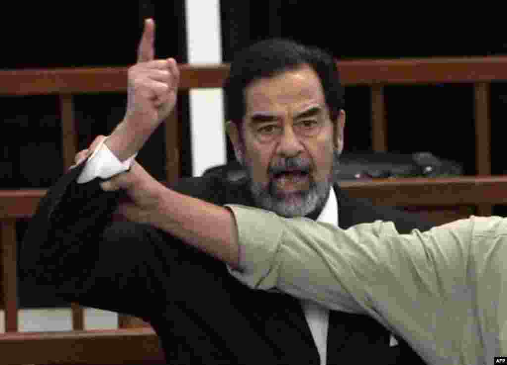 Former Iraqi leader Saddam Hussein shouts at the court as he is sentenced to death on November 5 (AFP) - In November, an Iraqi court sentenced former Iraqi President Saddam Hussein to death for crimes against humanity. UN experts said the trial was flawed, but few Iraqis doubted his guilt and many celebrated his sentence. While many called for the sentence to be carried out quickly, others argued that his other crimes should be investigated first. Hussein is now on trial for genocide against the Kurds.