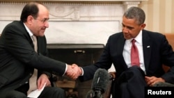Iraqi Prime Minister Nuri al-Maliki (left) shakes hands with U.S. President Barack Obama after a meeting at the White House in Washington in November.