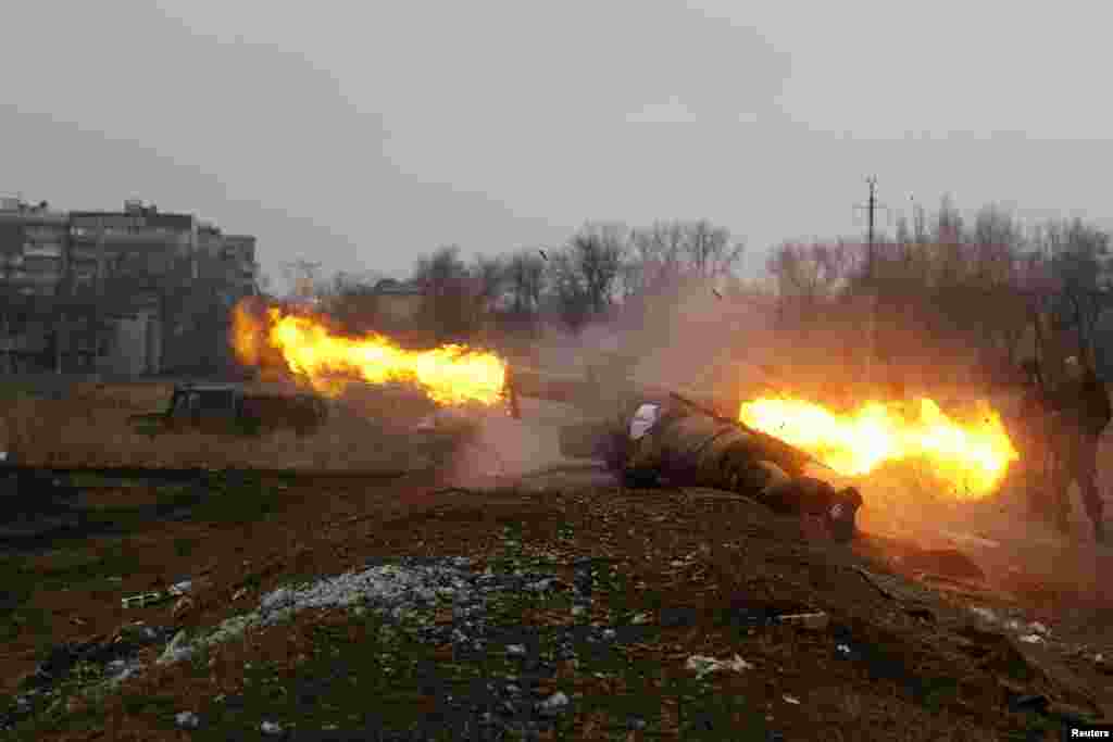 A rebel volunteer with the self-proclaimed Donetsk People&#39;s Republic fires a guided antitank missile during shooting training in eastern Ukraine on March 1. (Reuters/Baz Ratner)