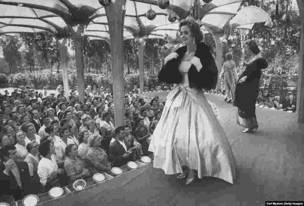 An American model sashays in an evening gown in Moscow. This fashion show and its rock and roll soundtrack was reportedly popular, but an exhibition of abstract U.S. art copped some harsh criticism. One Soviet visitor reportedly remarked, &ldquo;You had better keep [the abstract art] at home and use it on ranches to scare off crows.&rdquo;