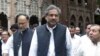 FILE: Former Pakistani Prime Minister Shahid Khaqan Abbasi (C) leaves a court in Lahore in June 2018.