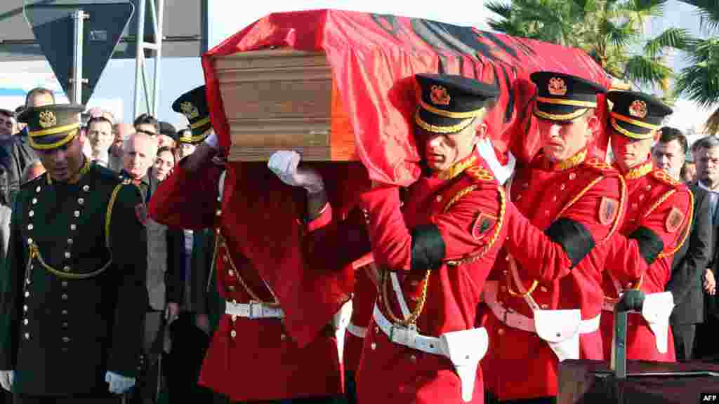 Albanian honor guards carry a coffin with the remains of Albania&#39;s self-proclaimed king, Zog I, after arriving back in his home country from France, where he died in exile in 1961. Zog&#39;s remains are due to be buried in a newly built mausoleum for the royal family in an official ceremony on November 17. (AFP)