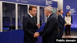 Armenian Prime Minister Nikol Pashinian holds a brief conversation with French President Emmanuel Macron on the sidelines of the 5th European Political Community Summit in Budapest, Hungary, November 7, 2024.