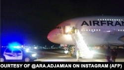 US -- Air France flight 65 out of Los Angeles bound for Paris stands on the tarmac in Salt Lake City where it was diverted late November 17, 2015 due to security threats. Two Air France flights bound for Paris from the United States were diverted late N