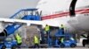 BOSNIA-HERZEGOVINA -- Bosnian airport workers unload cargo from a Boeing 747-400 airplane owned by the United Arab Emirates government after it landed at Sarajevo International Airport, May 27, 2020