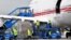 BOSNIA-HERZEGOVINA -- Bosnian airport workers unload cargo from a Boeing 747-400 airplane owned by the United Arab Emirates government after it landed at Sarajevo International Airport, May 27, 2020